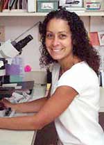 Dr. Baker at the microscope